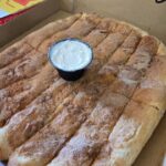 A pizza box with Sweet Sticks