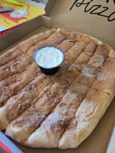 A pizza box with Sweet Sticks